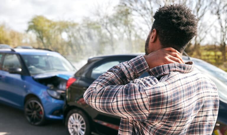 Person with neck injury from car collision seeking help from a California personal injury attorney.