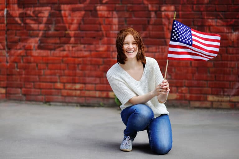 happy female immigration complete by immigration attorney Tulare