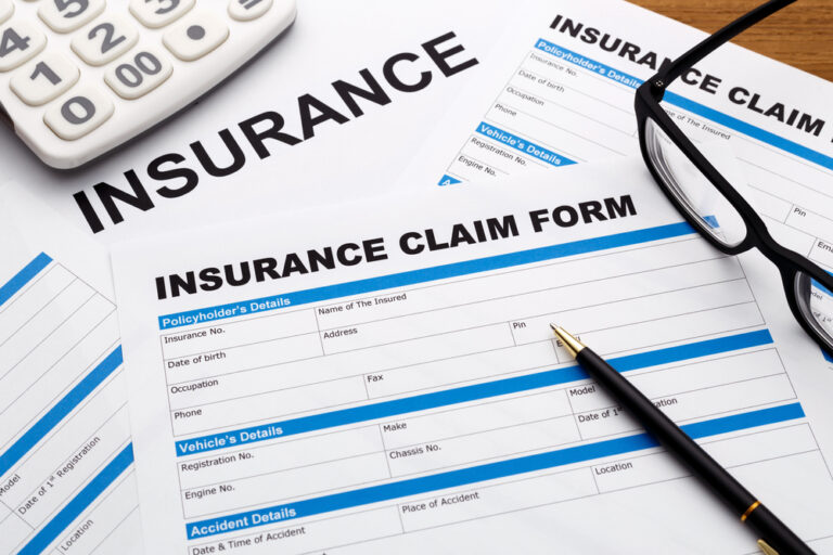 Insurance claim form with pen for personal injury attorney Kerman